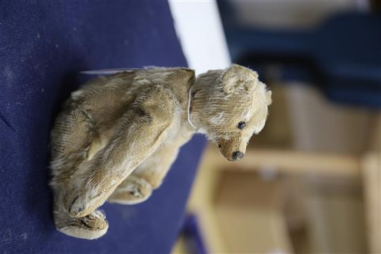 A vintage Steiff c1908 with button in ear, some hair loss generally, height 20cm